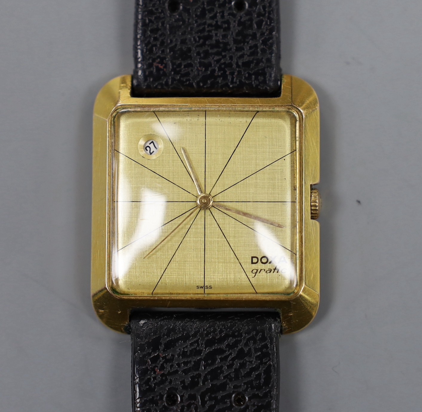 A gentleman's steel and gold plated Doxa Grafic manual wind wrist watch, with date aperture.